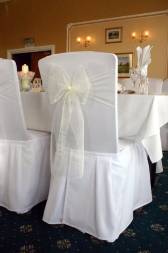 Ivory sash on our chair cover