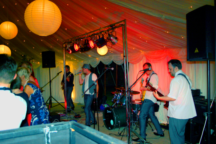 Band lighting in marquee wedding, Hertfordshire