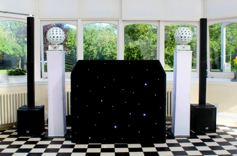 Black starcloth DJ set up in the Garden Court, Hanbury Manor, Ware, Herts