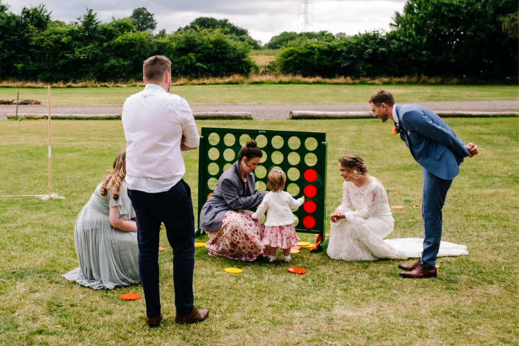 Family playing our lawn games at a herts wedding