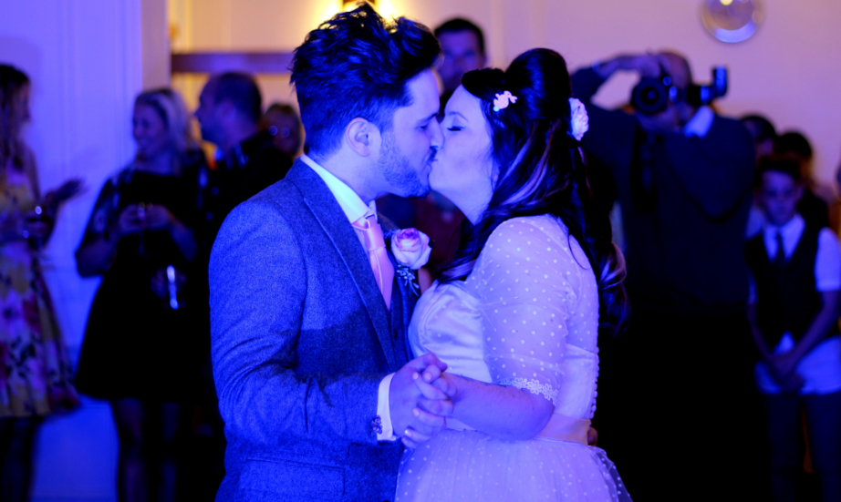 Happy couple kissing during the first dance