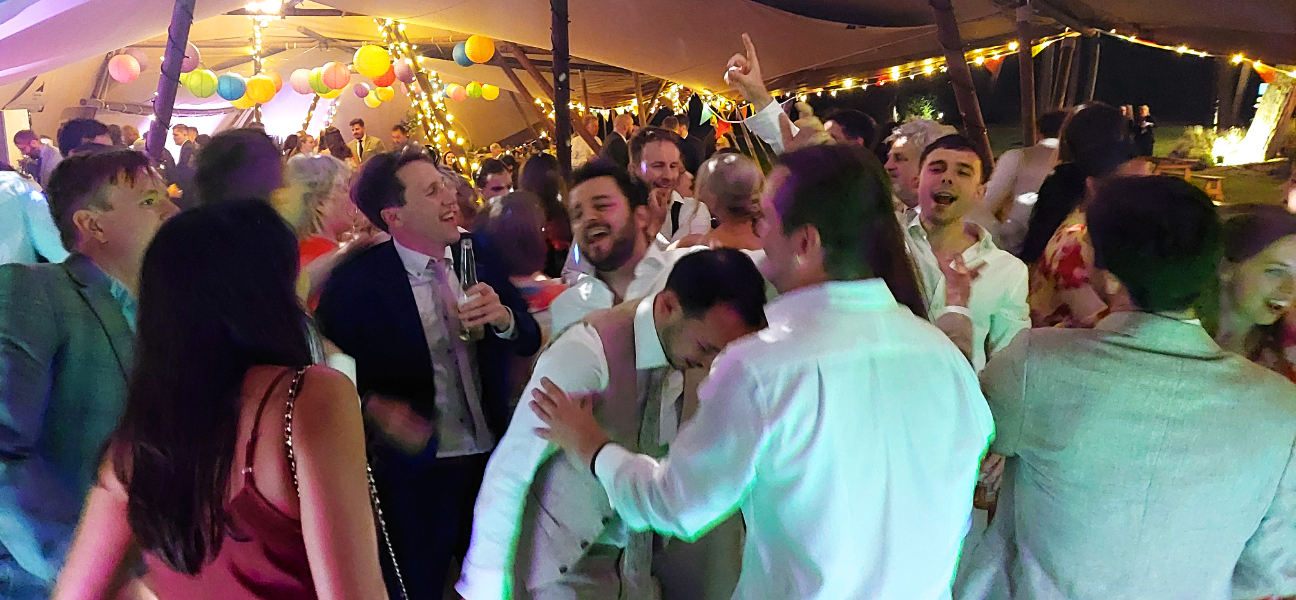 Wedding guests enjoying themselves on the dance floor